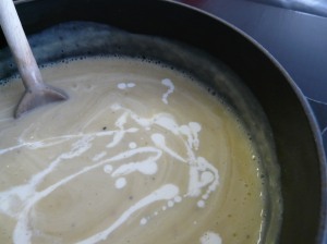 Adding cream to the soup